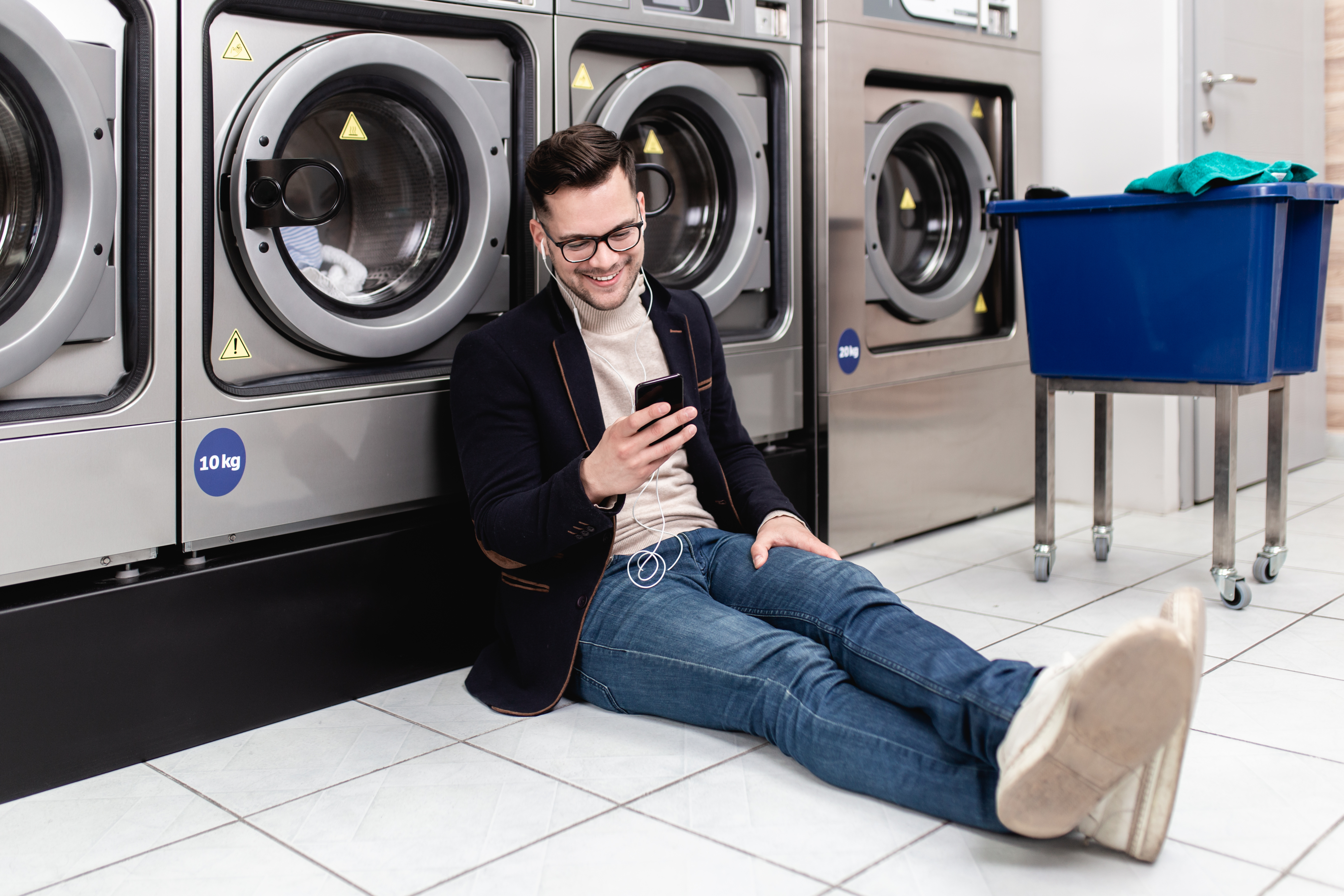 Man In Laundromat Regular Shutterstock 1334629649